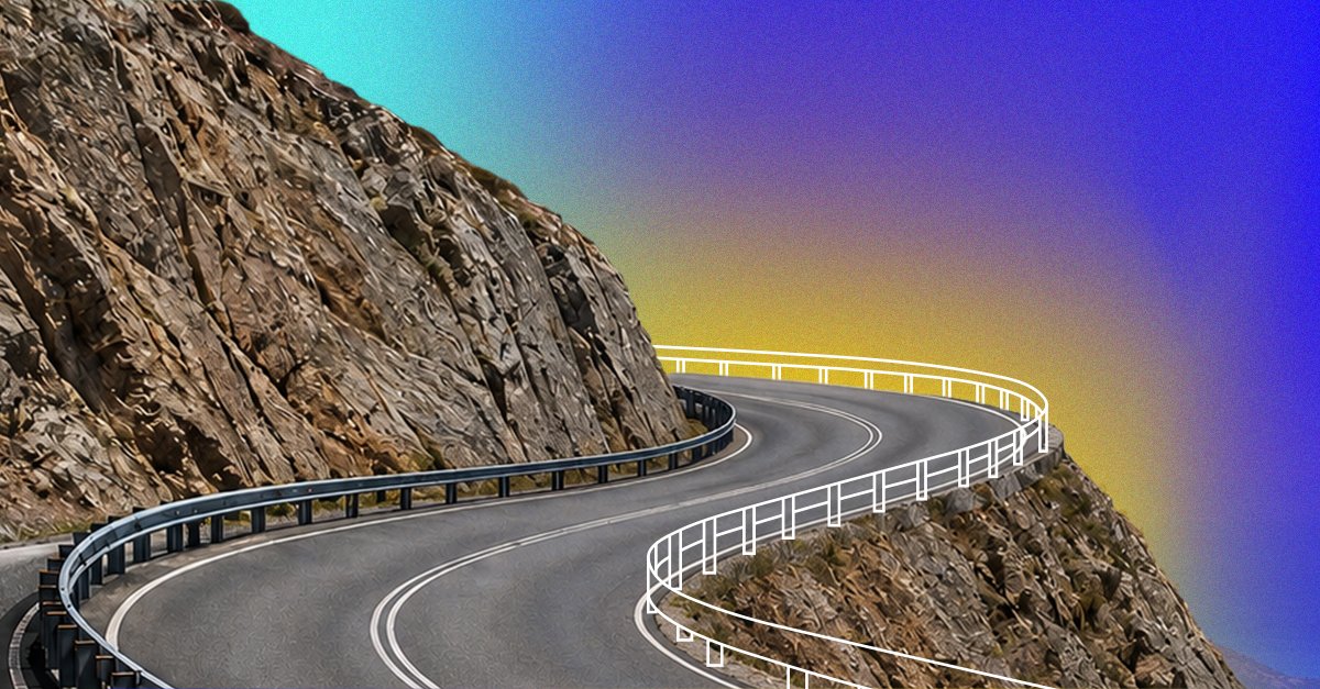 Winding mountain road with guardrails against a colorful gradient sky